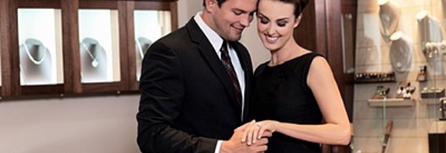 Couple inside a jewelry store shopping Image