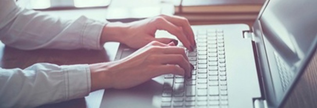 Woman typing on laptop image